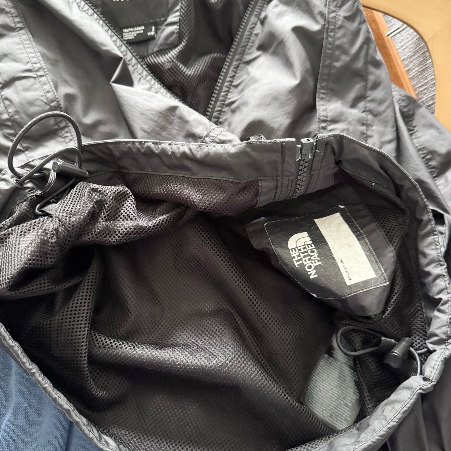 The North Face / Black windbreaker / 7-8Y