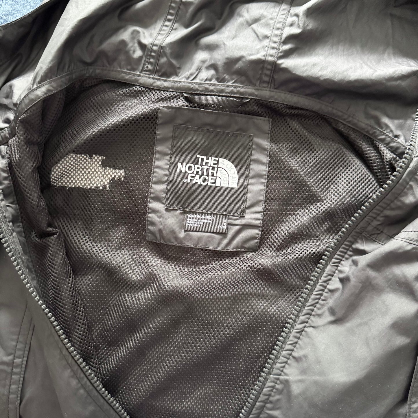 The North Face / Black windbreaker / 7-8Y