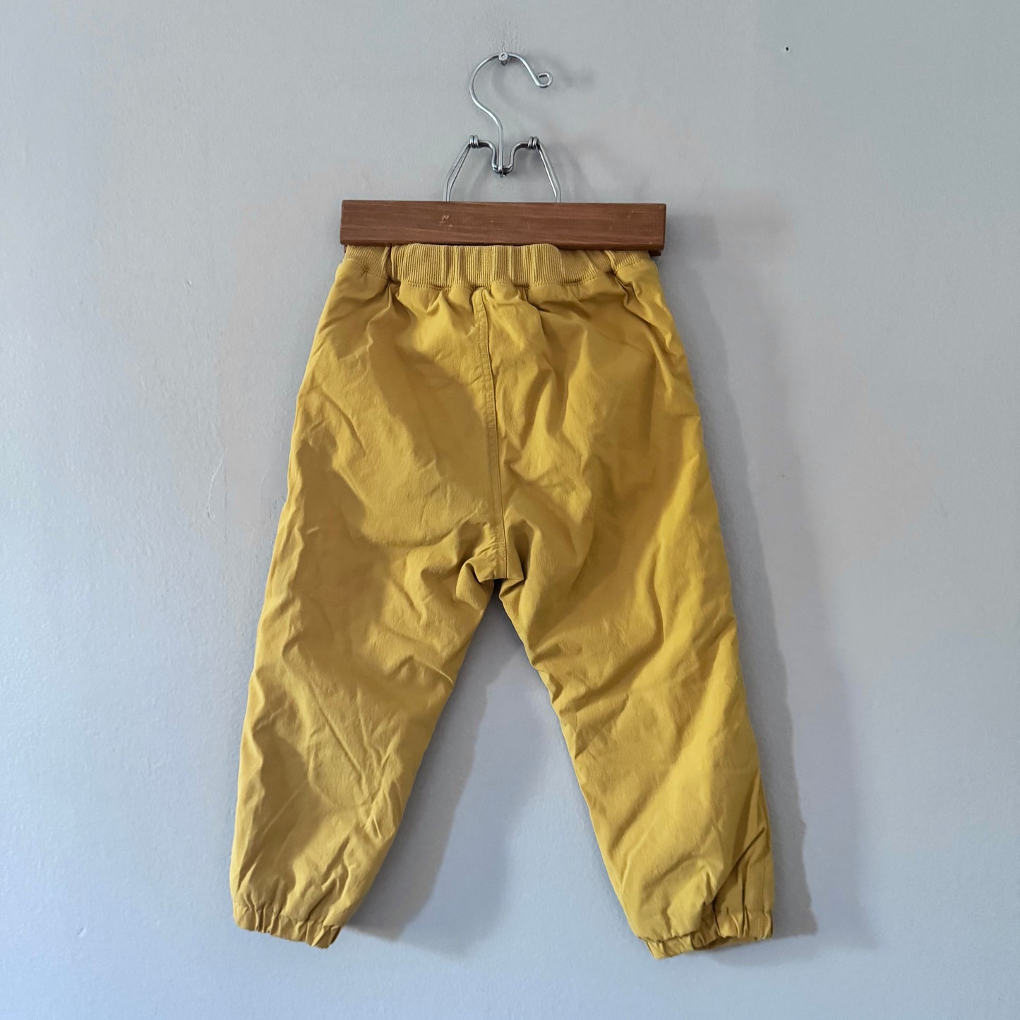Uniqlo / Mustard fleece lined nylon pants / 18-24M