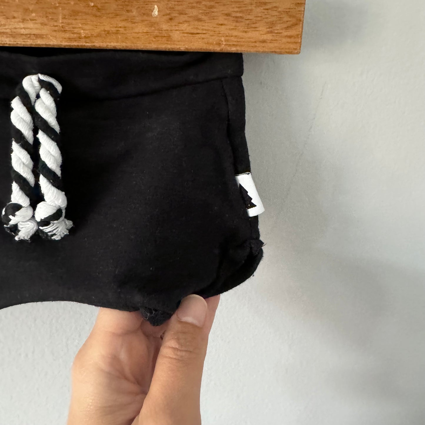 North Kinder / Black shorts / 0-6M