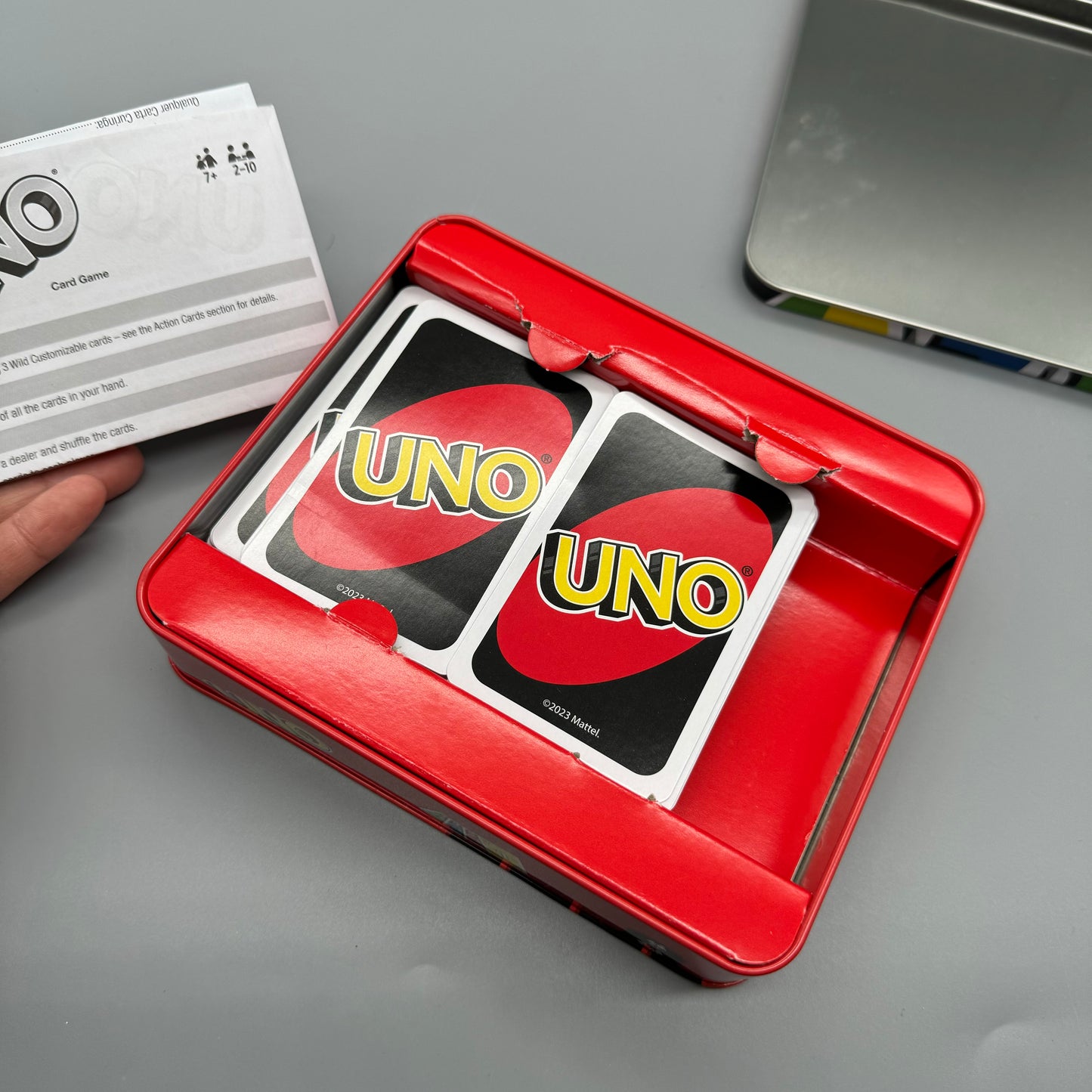 Uno cards in a tin case