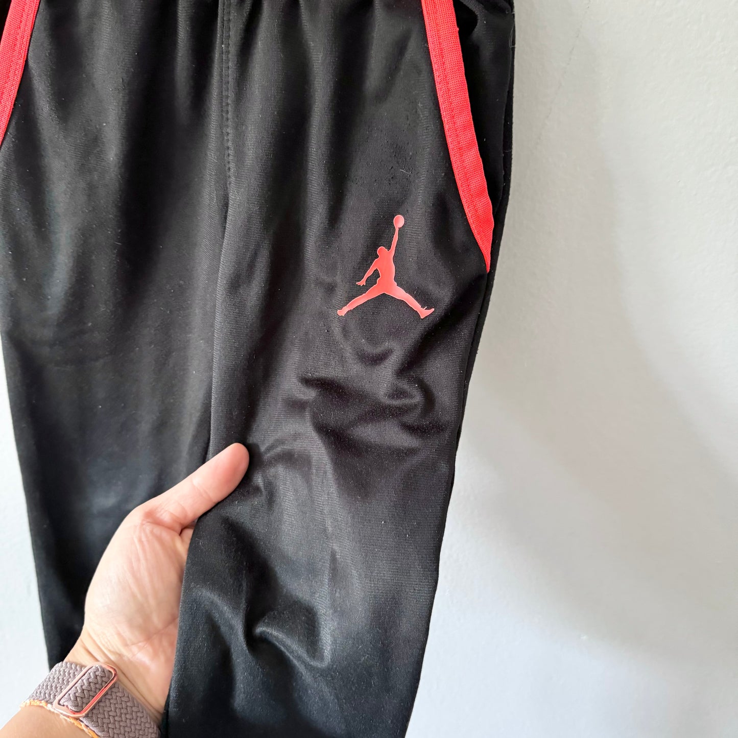 Jordan / Track pants - black x orange / 3-4Y